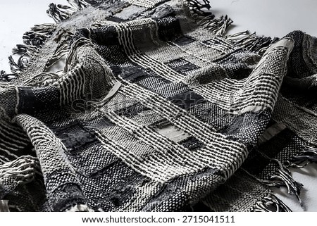 Vector fabric texture. Distressed texture of weaving fabric. Grunge background. Abstract halftone vector illustration. Overlay to create interesting effect and depth. Black isolated on white. EPS10.
