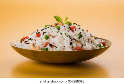 Veg Biryani Or Veg Pulav Served In A Round Brass Bowl, Selective Focus
