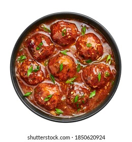 Veg Manchurian Gravy Balls In Black Bowl Isolated On White. Vegetarian Manchurian Is Indian Chinese Cuisine Dish. Asian Food And Meal. Top View