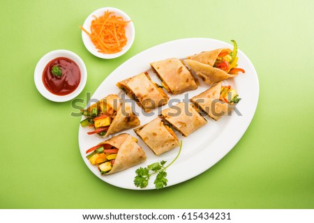 Veg Spring Roll OR Wrap OR Franky, made using Paneer and Vegetables stuffed inside Chapati or Roti. Served with Tomato Ketchup. Selective focus