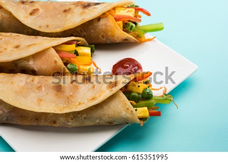 Veg Spring Roll OR Wrap also known as Franky, made using Paneer and Vegetables stuffed inside Chapati or Roti. Served with Tomato Ketchup. Selective focus