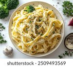 Vegan Alfredo Pasta with Creamy cashew-based Alfredo sauce tossed with fettuccine and steamed broccoli.