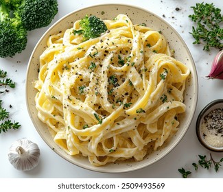 Vegan Alfredo Pasta with Creamy cashew-based Alfredo sauce tossed with fettuccine and steamed broccoli.