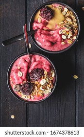 Vegan Berry Smoothie Bowl With Tahini And Muesli, Dark Background. Homemade Berry Ice Cream With Peanut Butter And Granola.