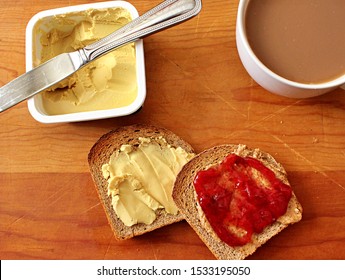 A Vegan Breakfast With Organic Free Trade Coffee, Almond Creamer, Homemade Whole Grain Toast, Almond Butter, Strawberry Jam, And Vegan Cream Cheese