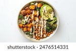 Vegan Buddha Bowl. A hearty bowl with a base of brown rice or quinoa, topped with roasted sweet potatoes, chickpeas, steamed broccoli, avocado, and a drizzle of tahini sauce