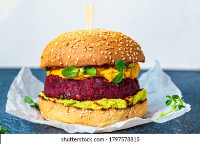 Vegan Burger With Beetroot Cutlet, Sweet Potato Sauce And Guacamole.