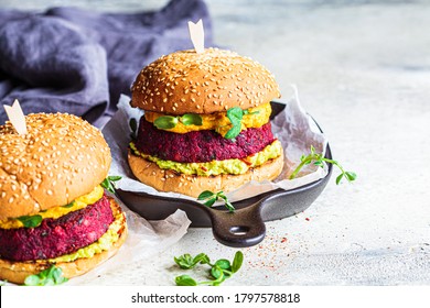 Vegan Burger With Beetroot Cutlet, Sweet Potato Sauce And Guacamole.