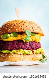 Vegan Burger With Beetroot Cutlet, Sweet Potato Sauce And Guacamole.