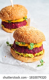 Vegan Burger With Beetroot Cutlet, Sweet Potato Sauce And Guacamole.