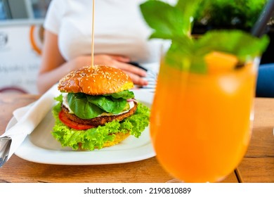 Vegan Burger Healthy Vegetarian Hamburger. Salad, Avocado, Vegetable On Veggie Sandwich Eating Cute Woman. Vegetarian Hamburger Healthy Diet Food