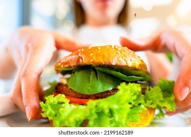 Vegan Burger Healthy Vegetarian Hamburger. Salad, Avocado, Vegetable On Veggie Sandwich Eating Cute Woman. Vegetarian Hamburger Healthy Diet Food.
