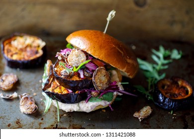 Vegan burger with white bean puree and spicy aubergine slices