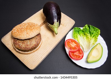 Vegan Burguer Made With Eggplant And Accompanied With Tomato, Lettuce And Avocado.