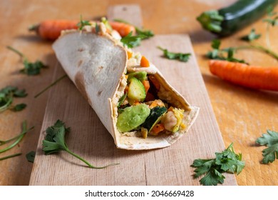 Vegan Burrito With Chickpeas, Zucchini, Carrots And Avocado