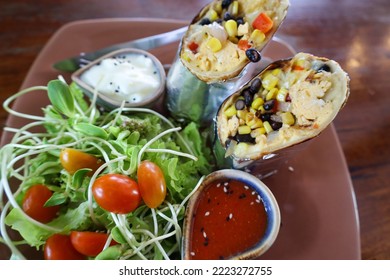 Vegan Burrito With Salat On A Plate