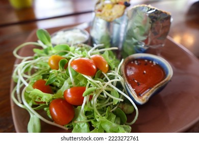 Vegan Burrito With Salat On A Plate