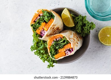 Vegan Burrito Wrap With Sweet Potato, Kale And Onion In Bowl. Vegetarian Food Concept.