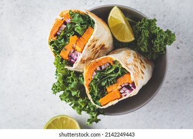 Vegan Burrito Wrap With Sweet Potato, Kale And Onion In Bowl. Vegetarian Food Concept.