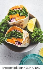 Vegan Burrito Wrap With Sweet Potato, Kale And Onion In Bowl. Vegetarian Food Concept.