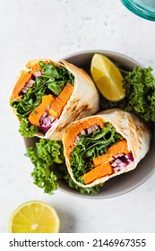 Vegan Burrito Wrap With Sweet Potato, Kale And Onion In Bowl. Vegetarian Food Concept.