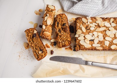 Vegan carrot cake with almonds on a white background, top view. Plant based food concept. - Shutterstock ID 1239647602