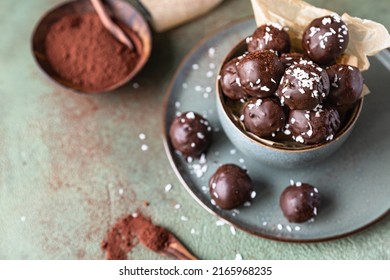 Vegan chickpea and peanut butter candies in chocolate glaze sprinkled with coconut chips. Energy balls. Healthy dessert without sugar. - Shutterstock ID 2165968235