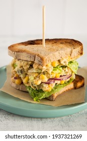 
Vegan Chickpea Sandwich With A Salad Made Of Chickpeas, Corn, Onion, Pickled Cucumber, And Mayonnaise. Healthy And High-protein Lunch.