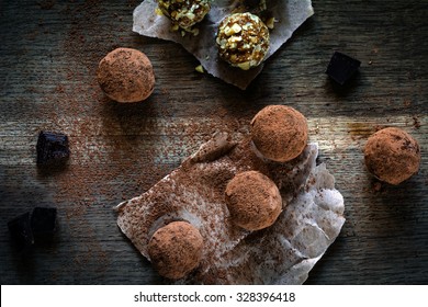 Vegan Chocolate Truffles On Textured Wooden Background