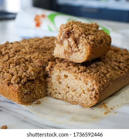 Vegan Coffee Cake Close Up. Soft And Light  Vanilla Cake With A Streusel Crumble On Top. The Cake Is Dairy Free And Is Made With Wholesome Ingredients.