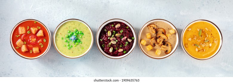 Vegan cream soups panorama. A variety of vegetable soups, top shot, flat lay