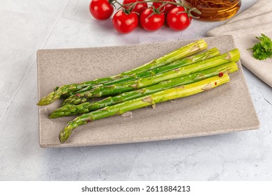 Vegan cuisine cooked asparagus stems with olive oil