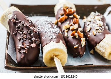 Vegan Dessert For Kids. Banana In Chocolate With Nuts.