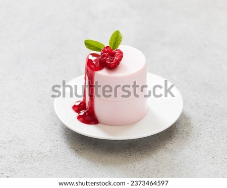 Vegan dessert. Raspberry cream pudding, Panna Cotta with sauce. Close up. Valentine's Day