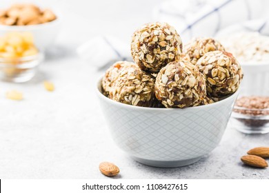 Vegan dessert, raw oatmeal nuts fruit bites. Selective focus, space for text.