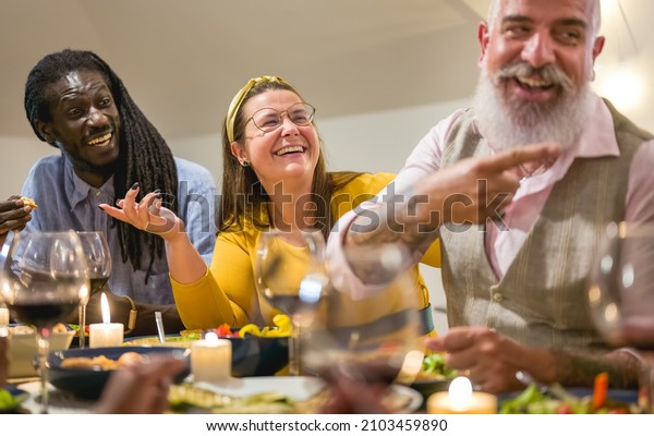 vegan dinner party with happy friends, different\
people african american having a vegetarian home meal,\
multicultural and multi age\
group