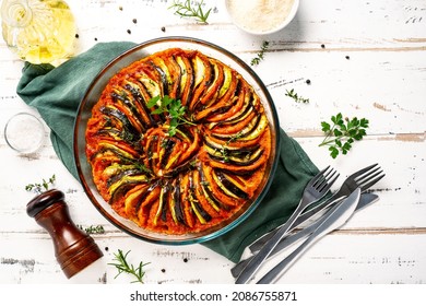 Vegan Dish Ratatouille Made Of Vegetables In A Baking Dish On Wihte Wooden Rustic Background