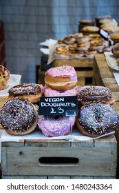 Vegan Doughnuts / Donuts Stacked Up In A Food Market