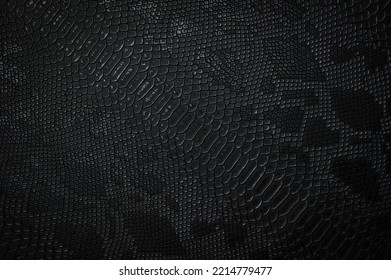 Vegan faux Snakeskin leather texture. minimalist and elegant textile. simple dark black backdrop