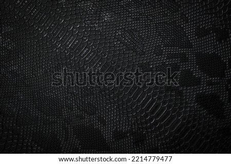 Vegan faux Snakeskin leather texture. minimalist and elegant textile. simple dark black backdrop