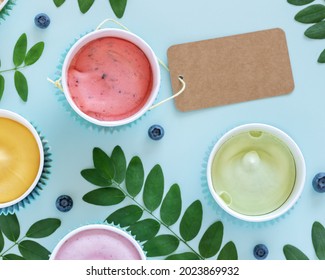 Vegan, Food Composition With Various Homemade, Vegan, Fruit Ice Cream, Leaves, Blueberries And Empty Label On A Blue Background. Dairy Free, Fruit Ice Cream Or Frozen Yogurt. Flat Lay