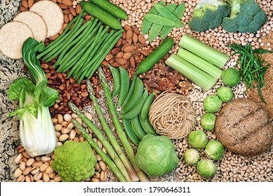Vegan food for healthy diet  with foods high in protein, vitamins, minerals, antioxidants, omega 3, smart carbs and dietary fibre. Mindful eating concept. Flat lay.