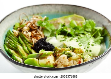 Vegan Food - Poke Bowl With Vegetables, Edamame Beans, Soybean Sprouts. Poke Bowl With Avocado And Vegetables Isolated On White Background. Eat Less Meat. Plant - Based Eating