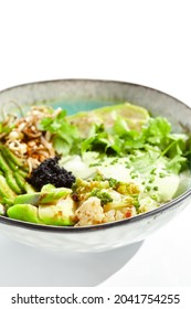 Vegan Food - Poke Bowl With Vegetables, Edamame Beans, Soybean Sprouts. Poke Bowl With Avocado And Vegetables Isolated On White Background. Eat Less Meat. Plant - Based Eating