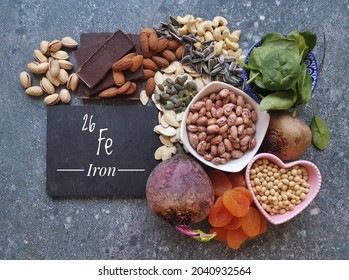Vegan food rich in iron with symbol Fe and atomic number 26. Natural products containing iron, minerals, vitamins. Healthy sources of iron, healthy eating concept.