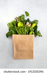 Vegan Food Shopping Or Delivery Concept, Top Down View On A Variety Of Fresh Green Leafy Produce In A Paper Bag 