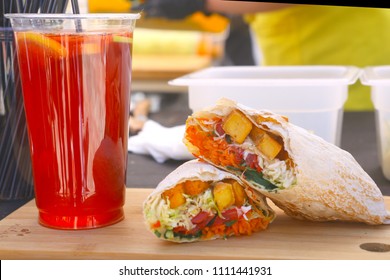 Vegan Food Wrap With Fruit Tea On Market Stall Close Up Photo