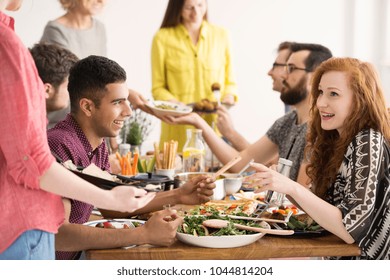 Vegan Friends Smiling At Each Other And Eating Healthy Salad