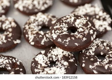 Vegan Gluten Free Chocolate Covered Cake Doughnuts With Coconut Sprinkles.