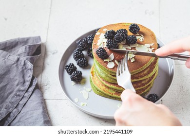 Vegan Green Matcha Pancakes With Blackberries, Syrup And Almonds. Plant-based Recipe, Healthy Breakfast, Alternative Food Concept.